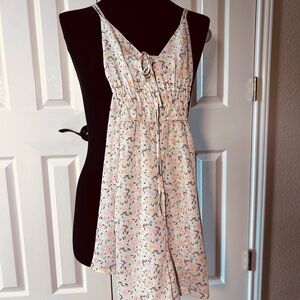 The Copper Closet Floral V-Neck Romper in Light Pink and Mint. Size M.